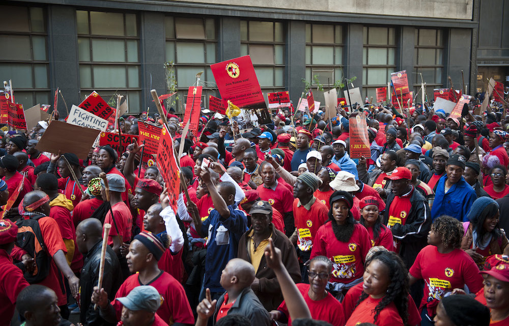 Unions rise against national minimum wage and new strike action draft laws